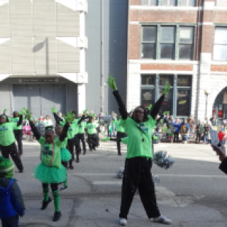 The Pleasant Green Baptist Church Marching Saints throw glitter and pompoms into the air. EMMA MIRNICS/EXPLORING